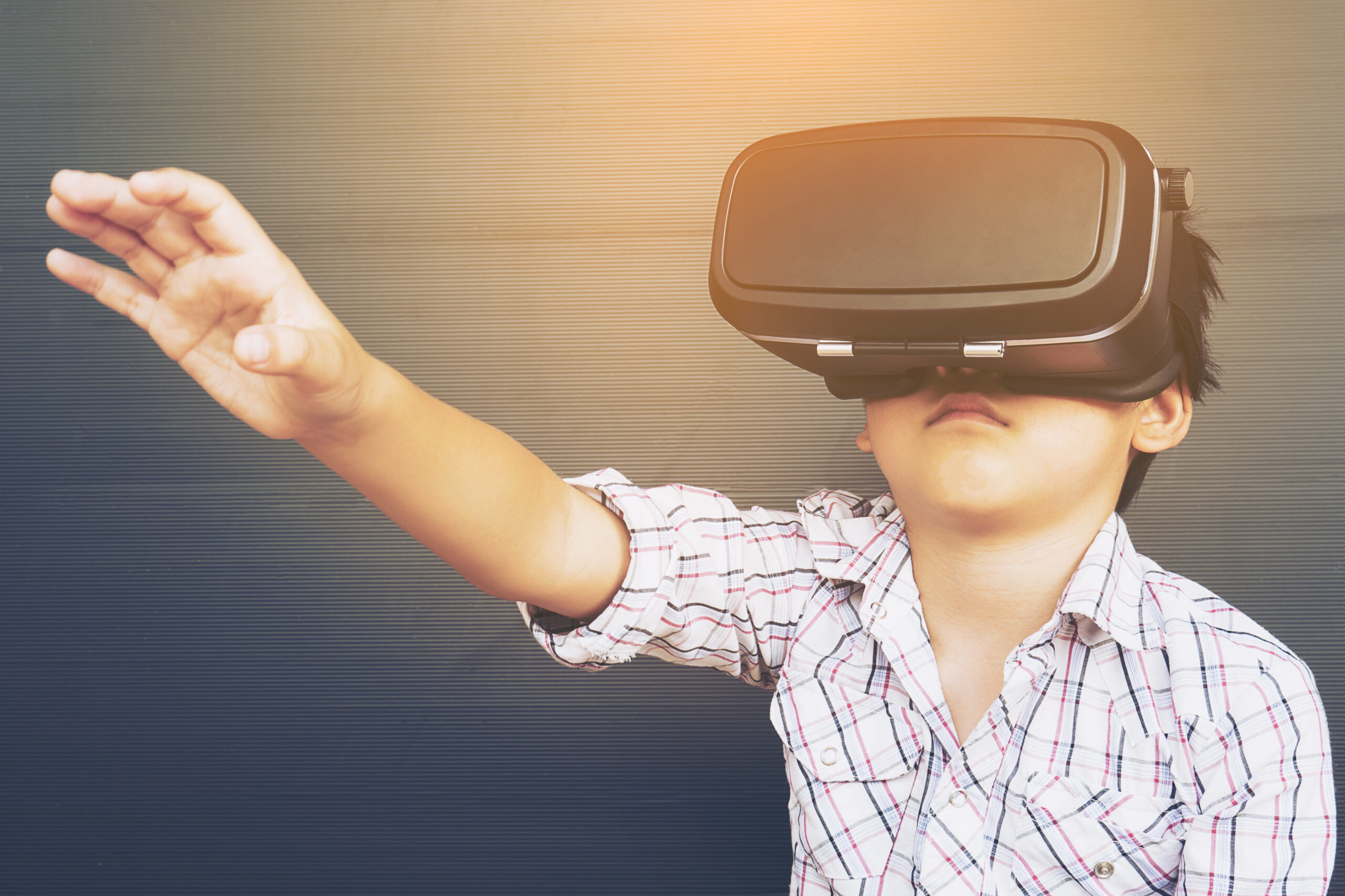 7 years kid playing VR virtual reality game